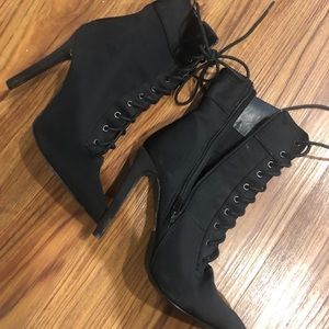 Pointed lace up booties
